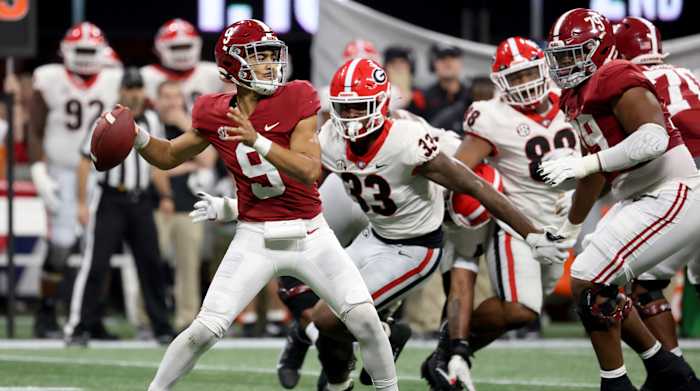 Dec 4, 2021; Atlanta, GA, USA; Alabama Crimson Tide quarterback Bryce Young (9) attempts a pass against Georgia Bulldogs linebacker Robert Beal Jr. (33) during the second quarter of the SEC championship game at Mercedes-Benz Stadium.
